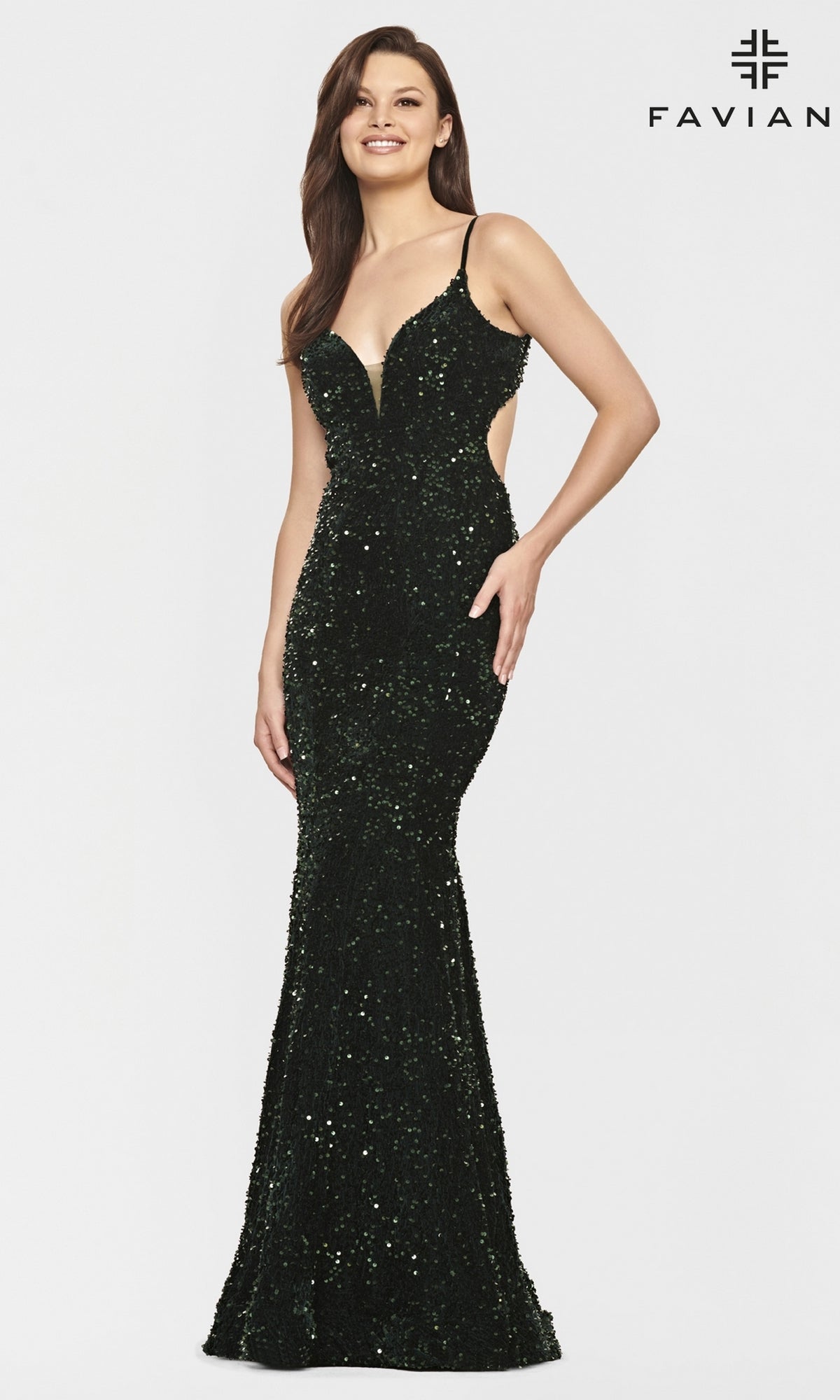 A woman poses against a white backdrop with the Faviana logo, wearing the Faviana Dark Green Long Sequin Prom Dress featuring a fitted silhouette, thin straps, and elegant sparkle.